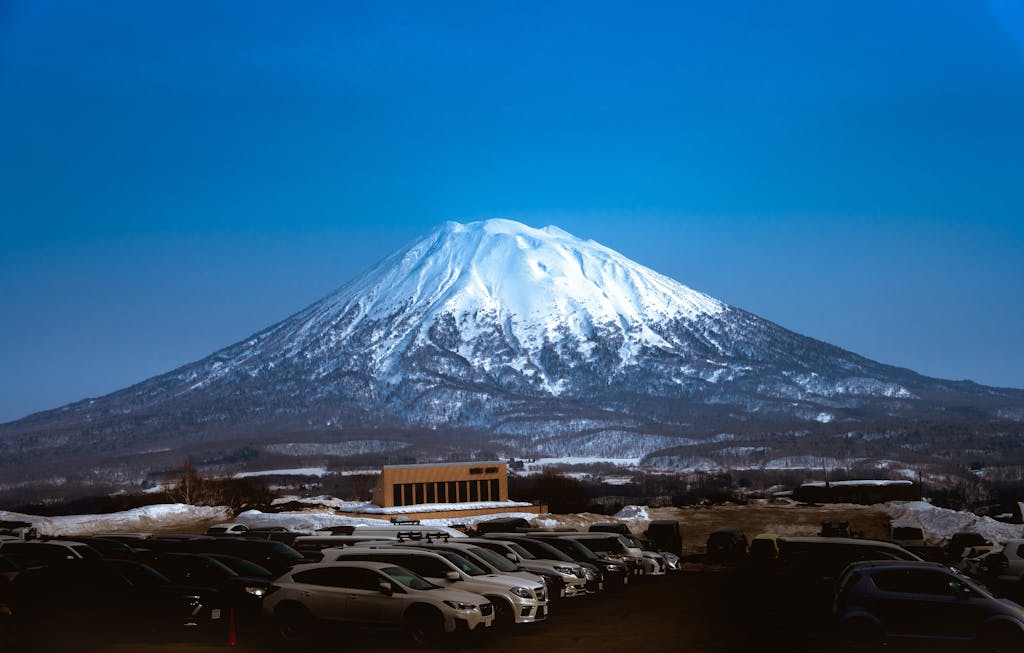 Stunning view of snowcapped Mount Yotei in Niseko, Hokkaido with a clear blue sky.